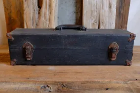 Alexander's rusty black suitcase